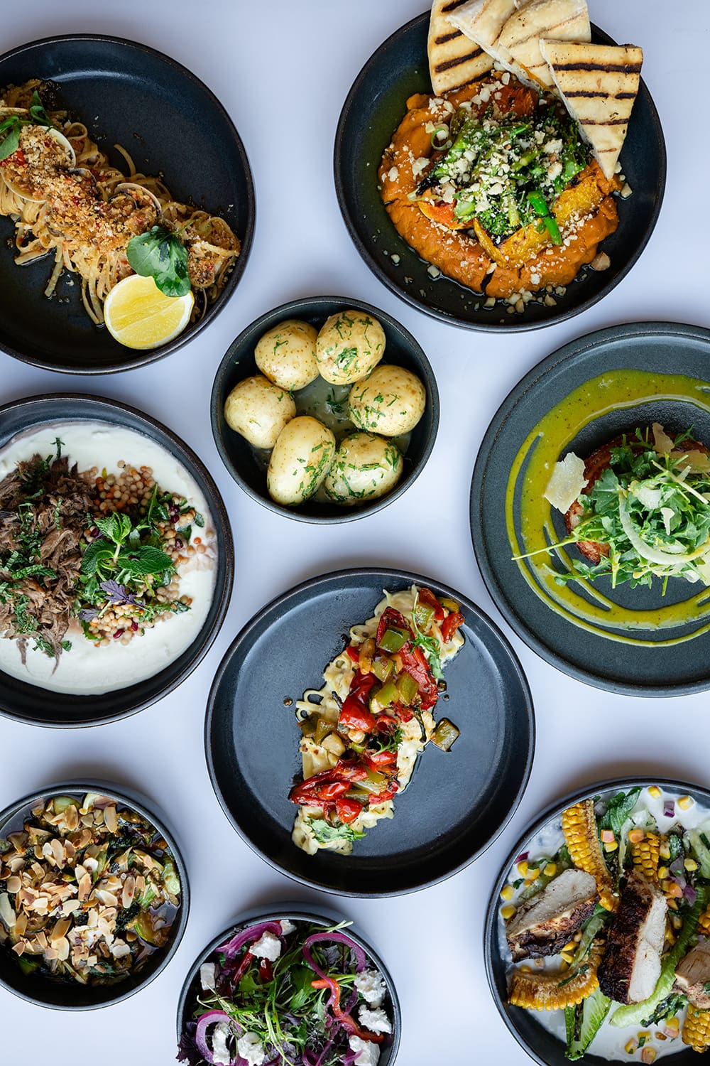 An overhead shot of a selection of colourful dinner a la carte menu items from The Commodore Mount Gambier's restaurant.